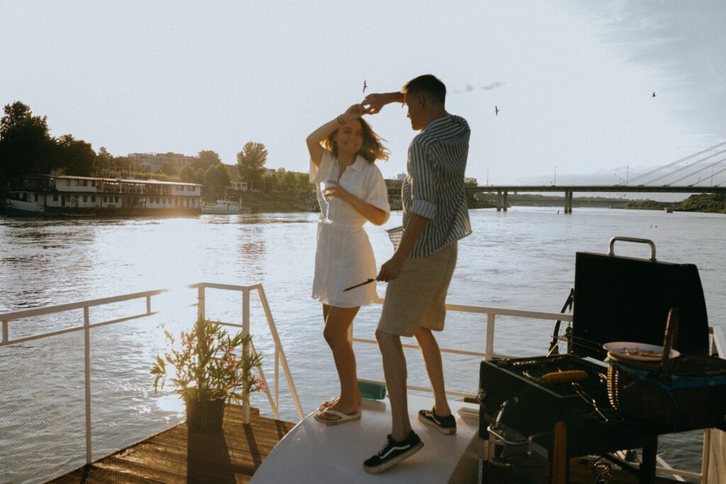 A couple dancing on a yacht.