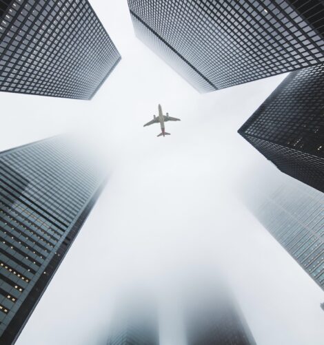 Airplane passing through a city