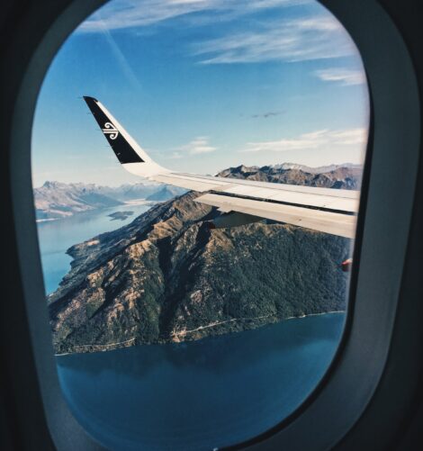 An airplane's wings being seen through its window