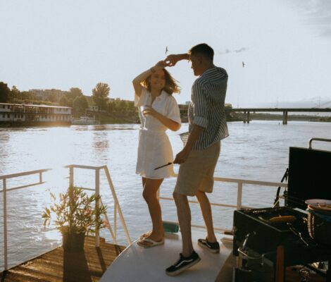 A couple dancing on a yacht.